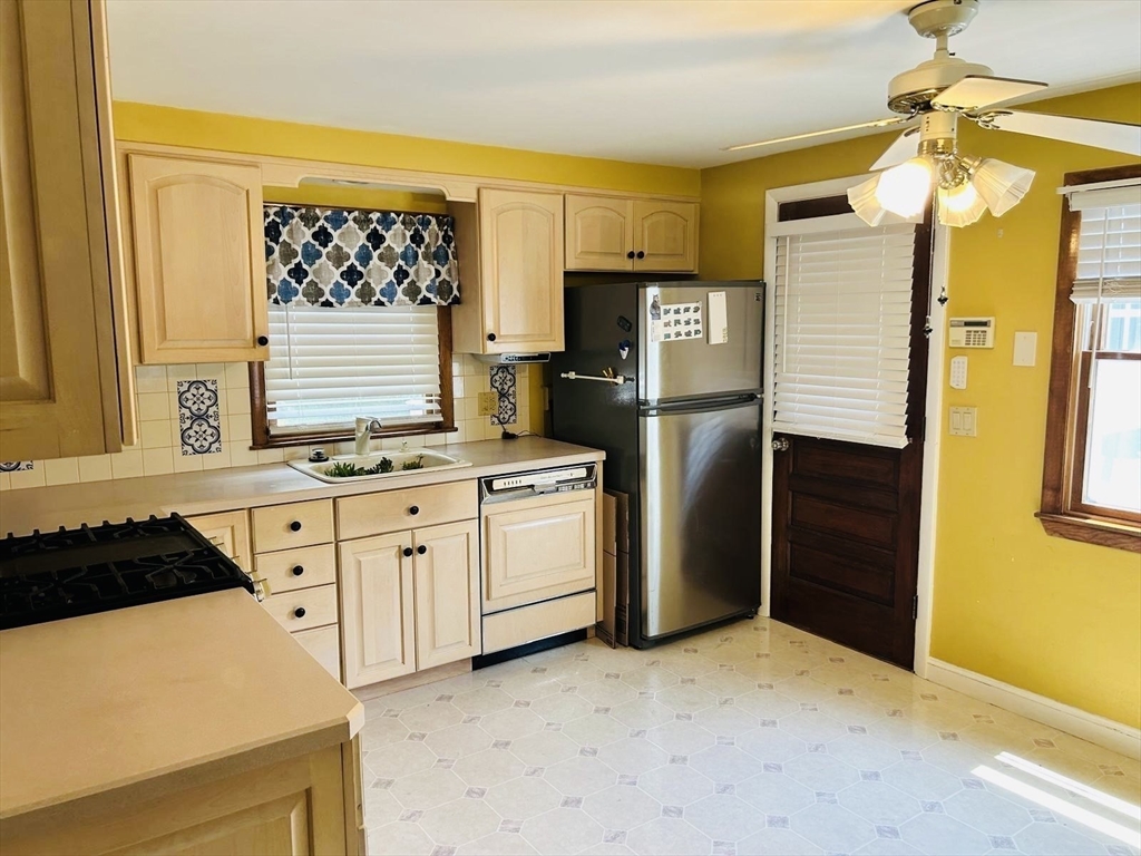 52 Westview Road Lynn, MA 01902 - Photo 6 of 32 a kitchen with stainless steel appliances a refrigerator and a stove top oven