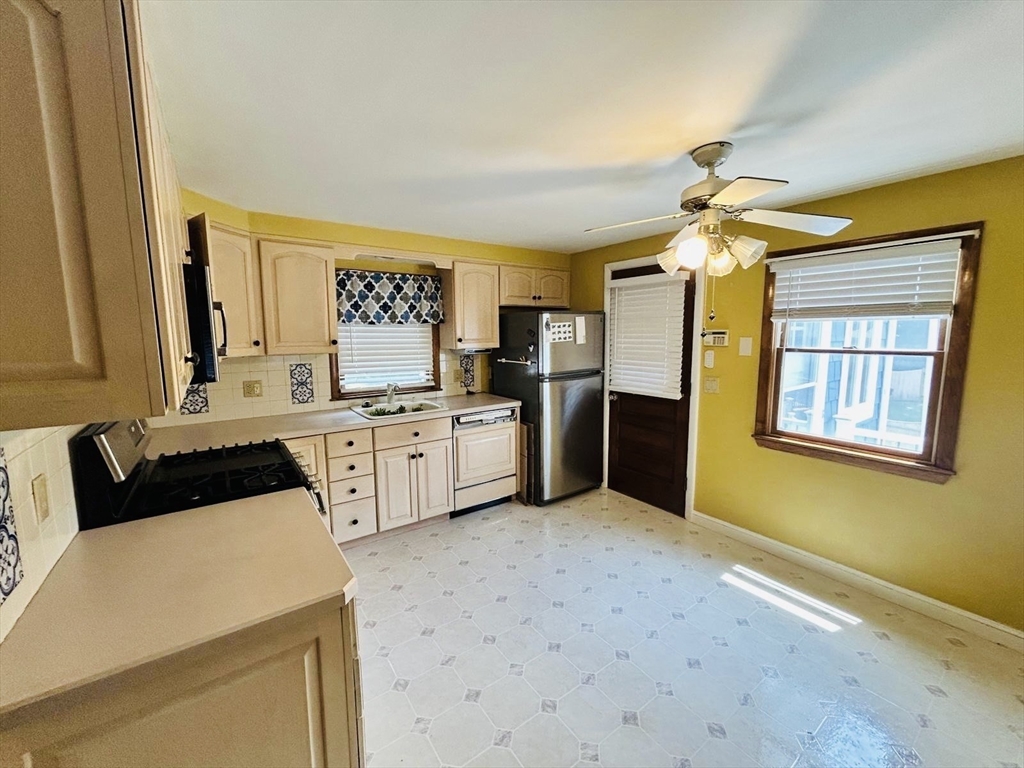 52 Westview Road Lynn, MA 01902 - Photo 7 of 32 a kitchen with stainless steel appliances a sink cabinets and window