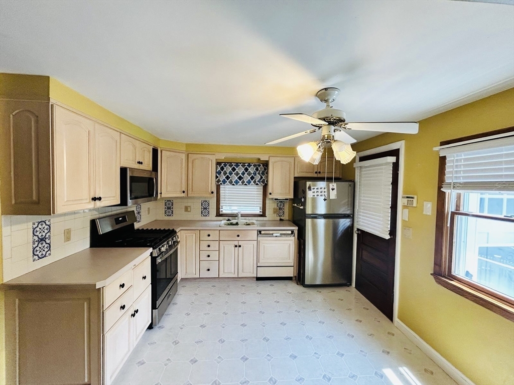 52 Westview Road Lynn, MA 01902 - Photo 8 of 32 a kitchen with a sink stove and refrigerator