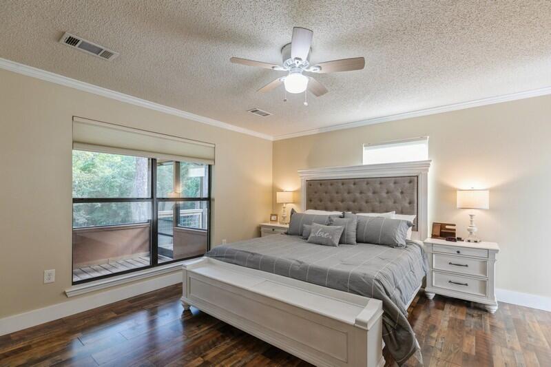 5540 Old River Road Baker, FL 32531 - Photo 12 of 37 a bedroom with a large bed and a chandelier
