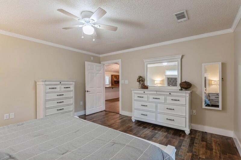 5540 Old River Road Baker, FL 32531 - Photo 14 of 37 a room with a cabinets and a dresser
