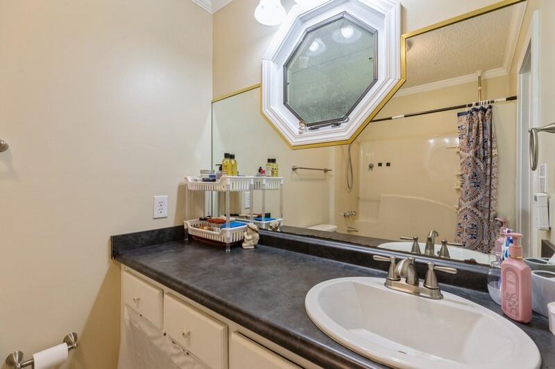 5540 Old River Road Baker, FL 32531 - Photo 18 of 37 a bathroom with a sink and a mirror