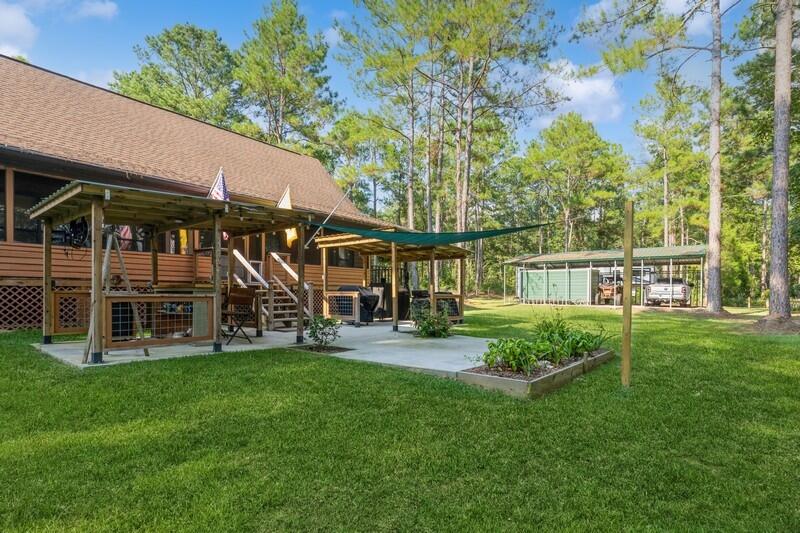 5540 Old River Road Baker, FL 32531 - Photo 27 of 37 a view of a house with a yard deck and sitting area