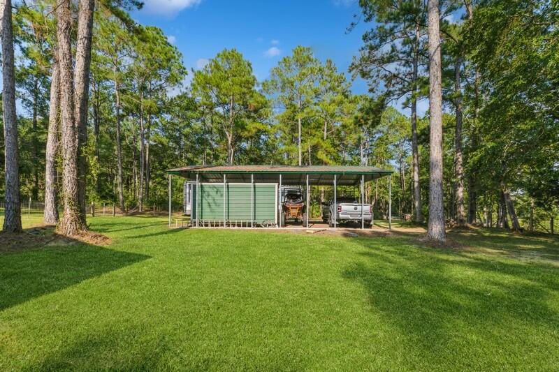 5540 Old River Road Baker, FL 32531 - Photo 28 of 37 a view of a house with backyard