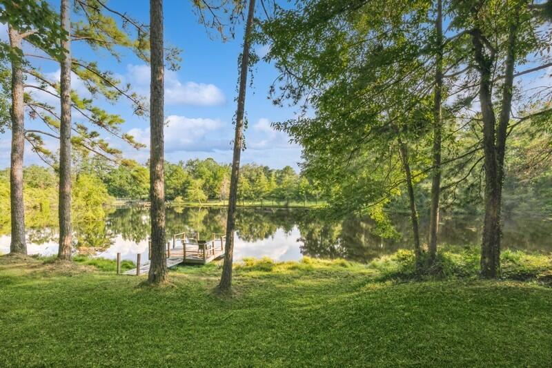 5540 Old River Road Baker, FL 32531 - Photo 30 of 37 a backyard of a house with lots of green space