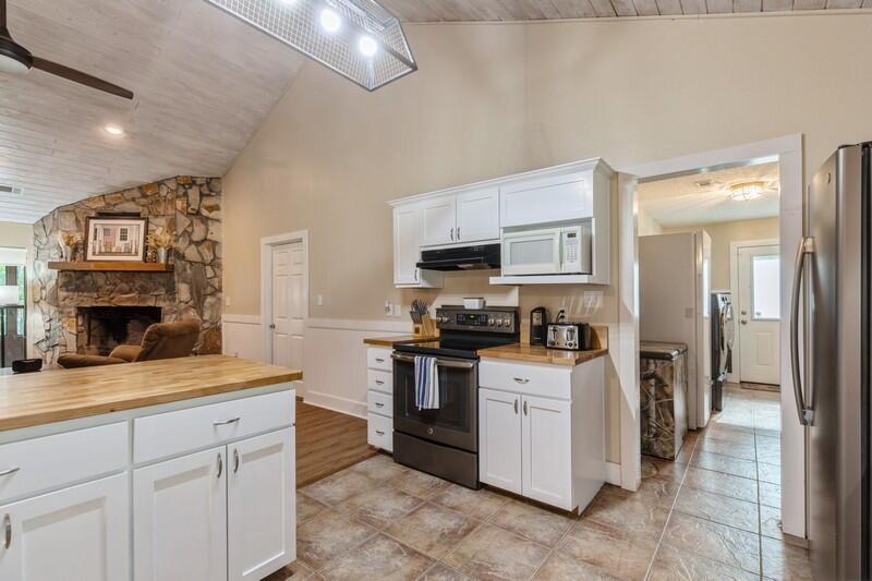 5540 Old River Road Baker, FL 32531 - Photo 9 of 37 a kitchen with cabinets and steel stainless steel appliances
