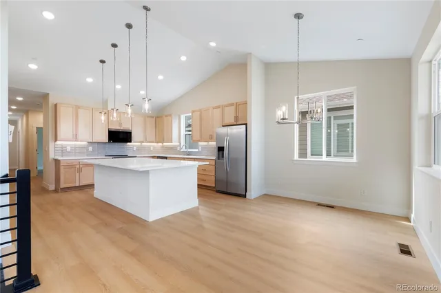 a spacious bathroom with a double vanity sink mirror and shower