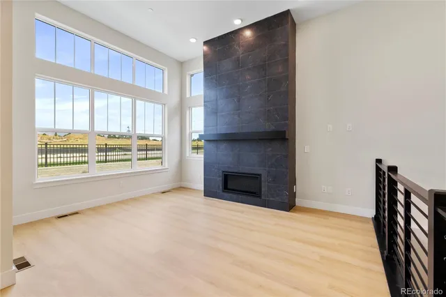 a kitchen with kitchen island a sink stove and wooden floor