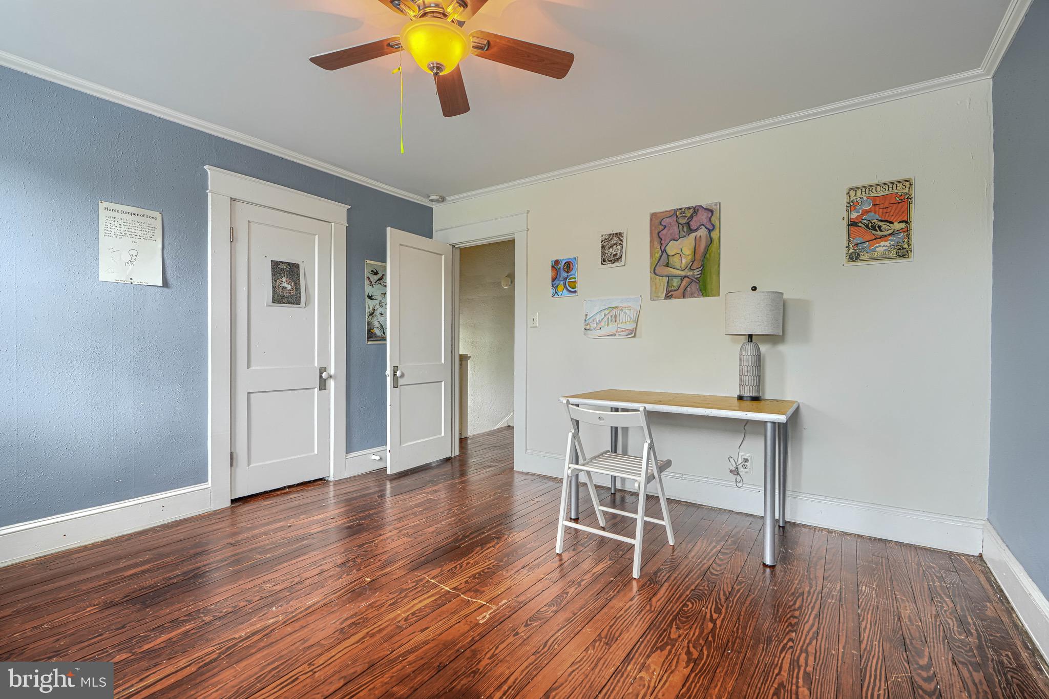 2705 Latona Road Baltimore, MD 21214 - Photo 32 of 53 a view of a workspace with wooden floor