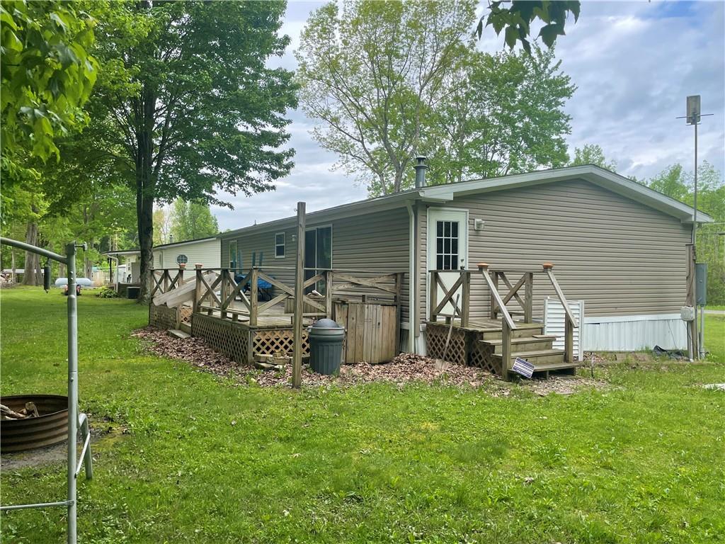 14624 Gilliland Road Linesville, PA 16424 - Photo 2 of 23 a view of a house with backyard sitting area and garden