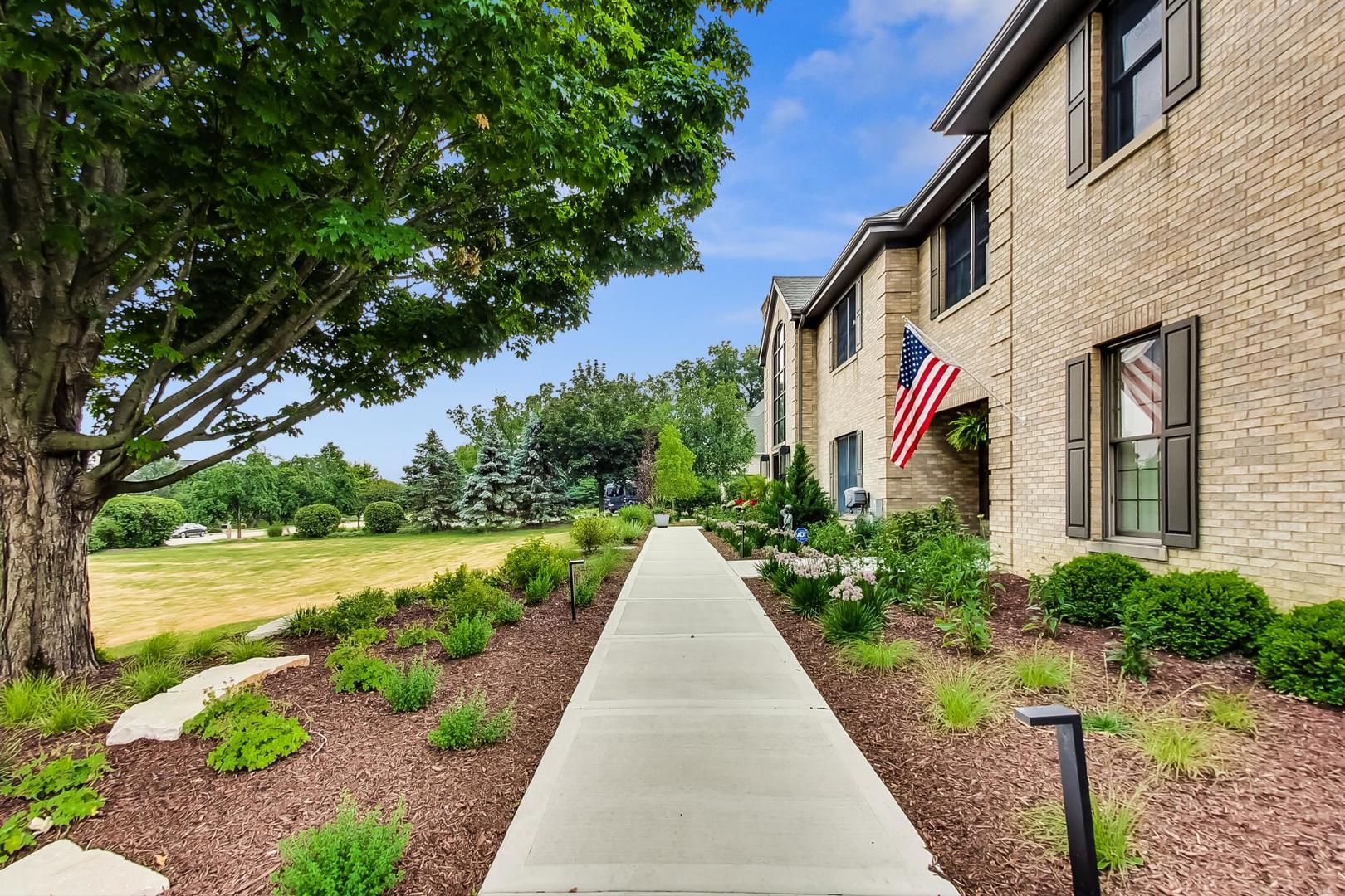 5N198 Dover Hill Road St. Charles, IL 60175 - Photo 5 of 65 a front view of a house with a yard and potted plants