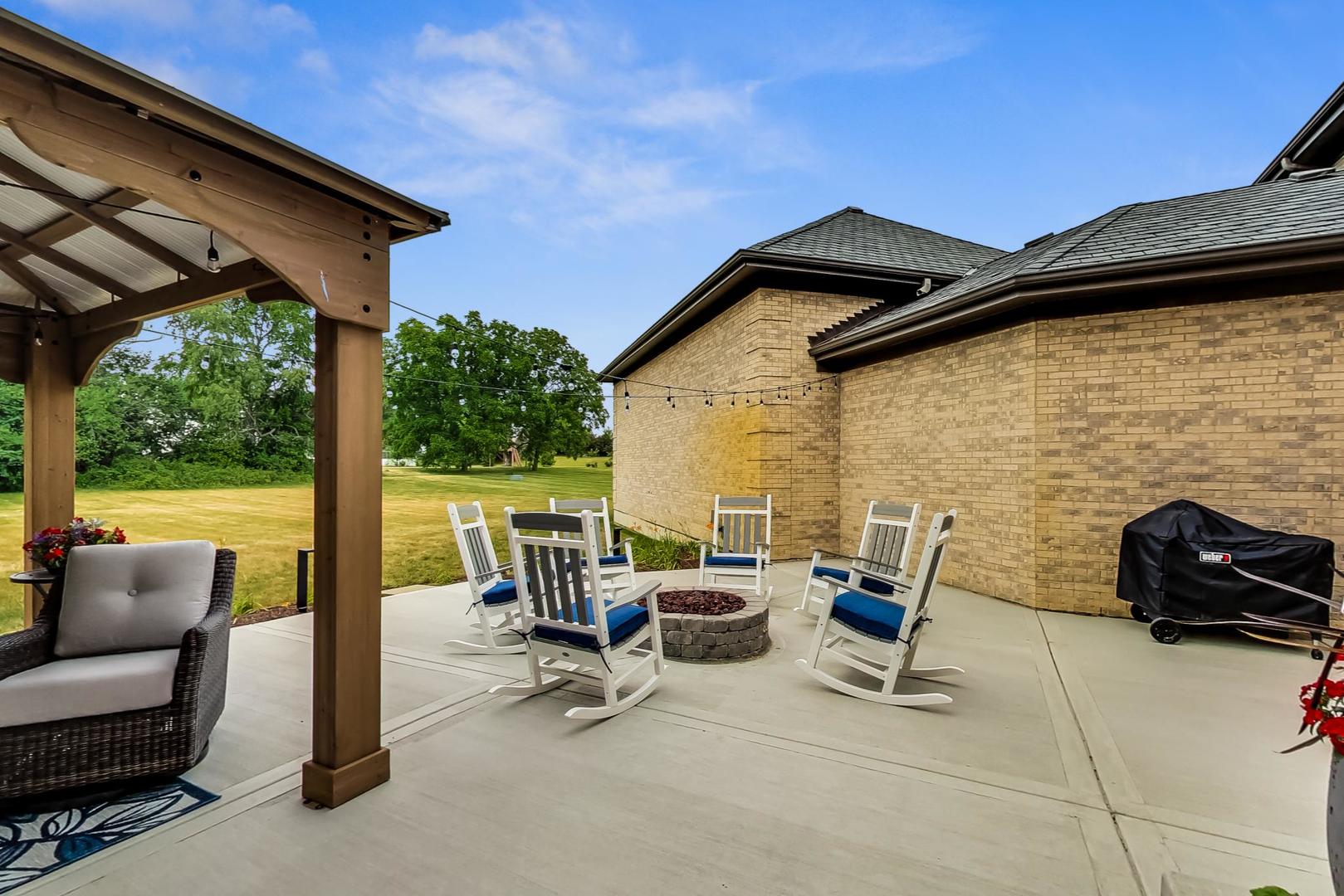 5N198 Dover Hill Road St. Charles, IL 60175 - Photo 54 of 65 a view of a patio with a table and chairs