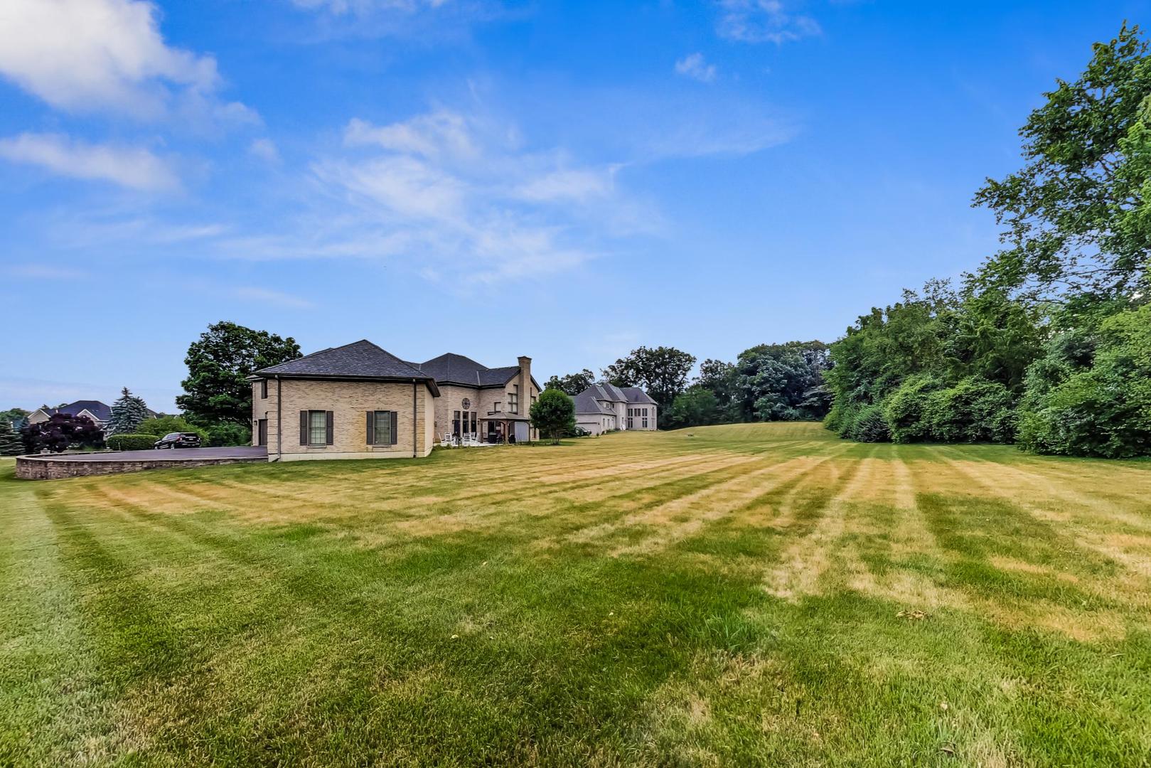 5N198 Dover Hill Road St. Charles, IL 60175 - Photo 55 of 65 a view of an house with pool and a yard