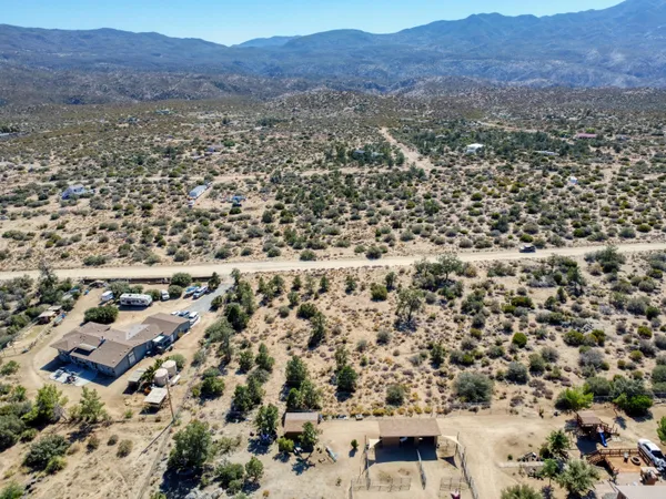 an aerial view of residential house and outdoor space