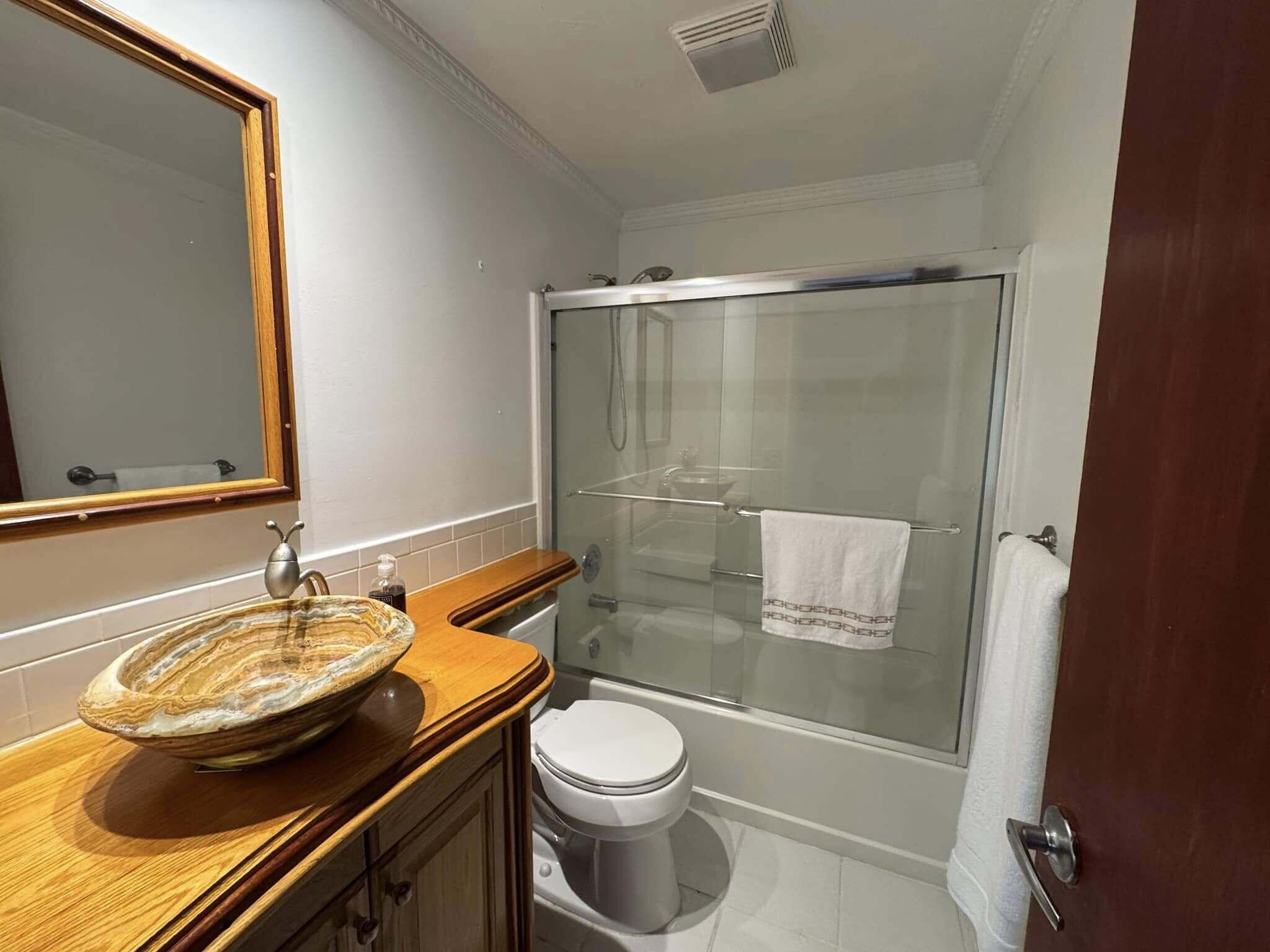 13 Bass Avenue Key Largo, FL 33037 - Photo 23 of 43 a bathroom with a sink toilet and shower