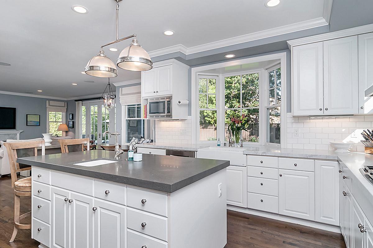 2 Brady Place Menlo Park, CA 94025 - Photo 18 of 33 a kitchen with kitchen island granite countertop a table and chandelier