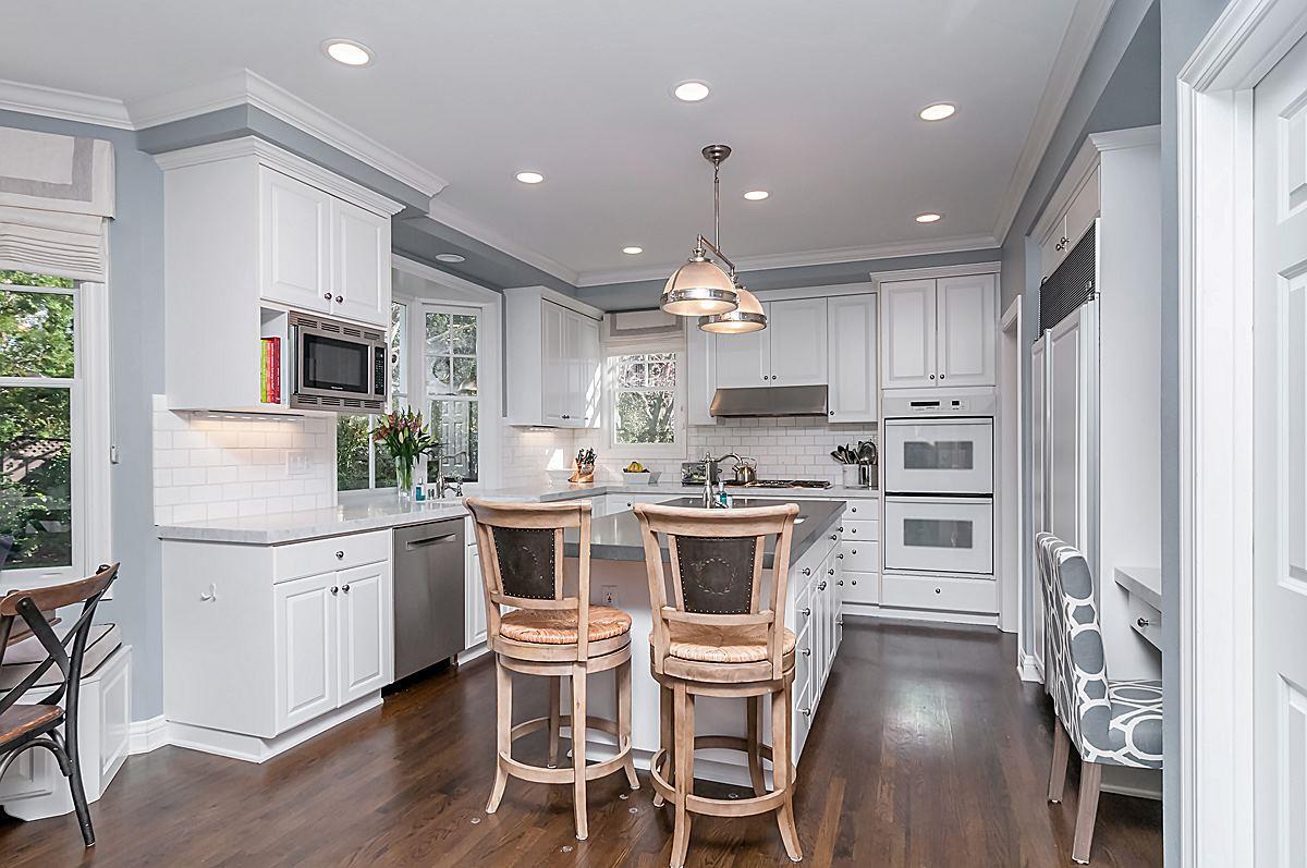 2 Brady Place Menlo Park, CA 94025 - Photo 19 of 33 a kitchen with stainless steel appliances kitchen island granite countertop a kitchen island a stove a table and chairs in it