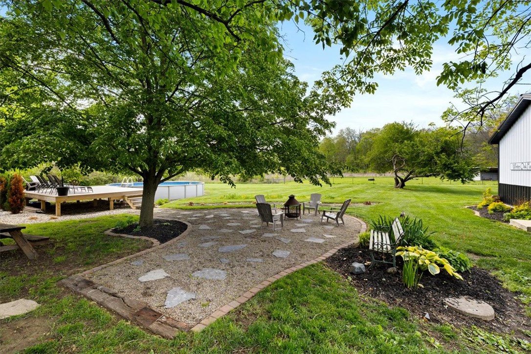 5120 Wheelock Road Troy, OH 45373 - Photo 41 of 67 Enjoy outdoor living with a spacious patio, inviting pool, and fire pit in this expansive yard.