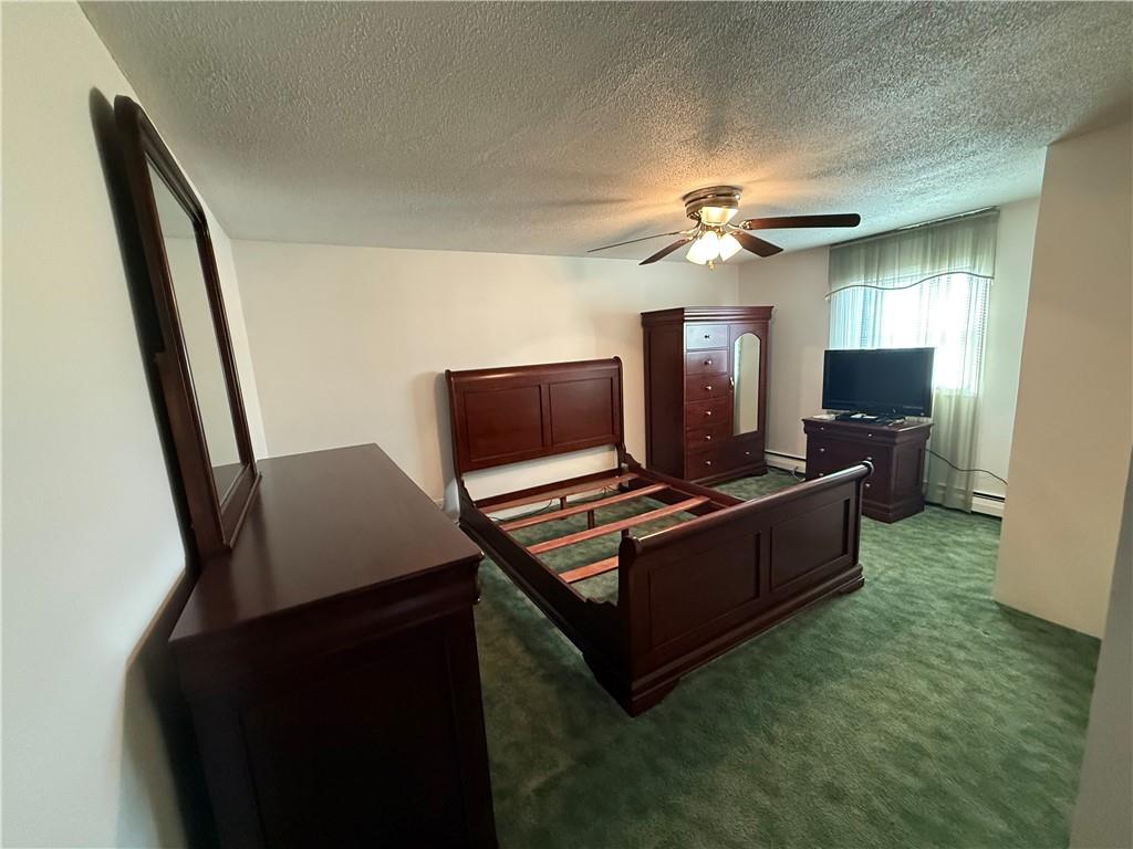 243 South Sycamore Street Mount Pleasant, PA 15666 - Photo 15 of 27 a living room with furniture and a flat screen tv