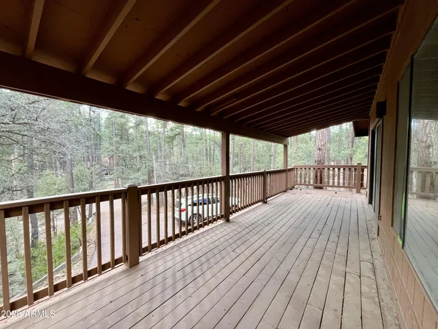 a view of balcony with wooden floor