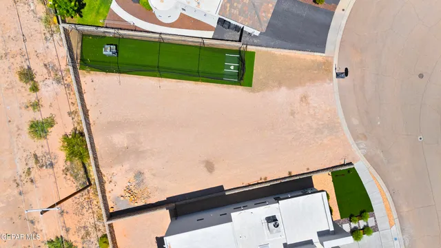 an aerial view of house with yard