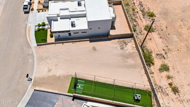 an aerial view of a house with outdoor space