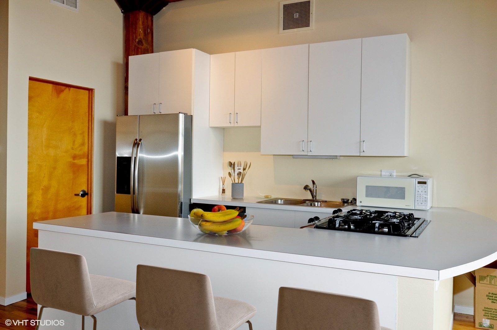 1000 West Washington Boulevard, Unit 348 Chicago, IL 60607 - Photo 7 of 9 a kitchen with a refrigerator and a stove top oven