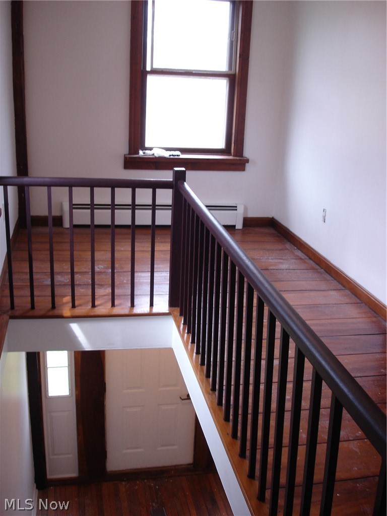 9733 Madison Road Montville, OH 44064 - Photo 19 of 31 Cute landing at top of stairs. Hard wood here as well.