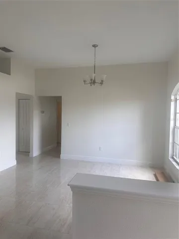 a view of a room that has a window in it