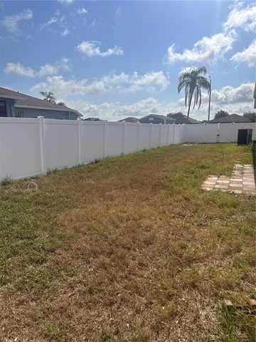 a view of a big yard with an outdoor space