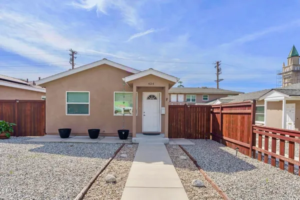 a view of a house with a barbeque
