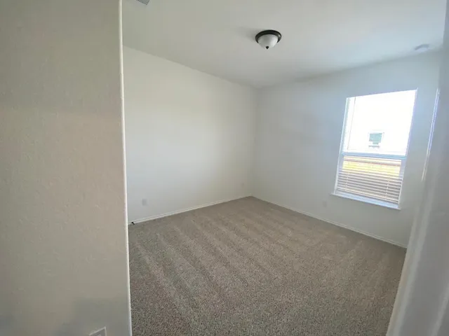 a view of a room that has a window in it