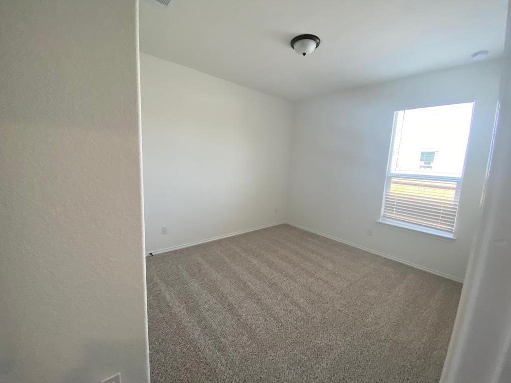 17110 Gibbons Path Round Rock, TX 78664 - Photo 8 of 12 a view of a room that has a window in it