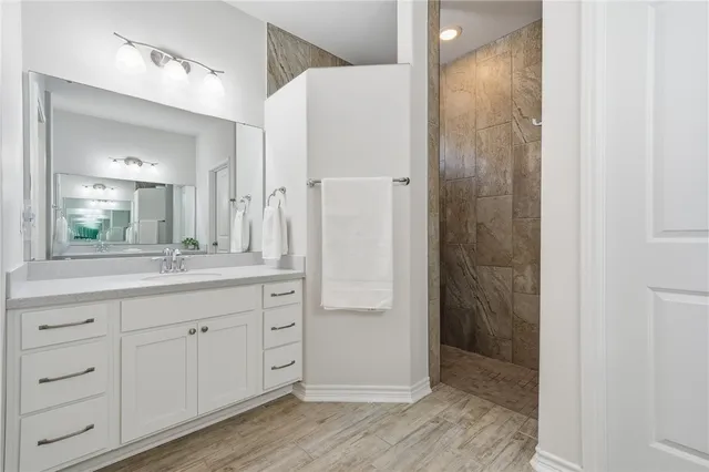 a bathroom with a double vanity sink and mirror