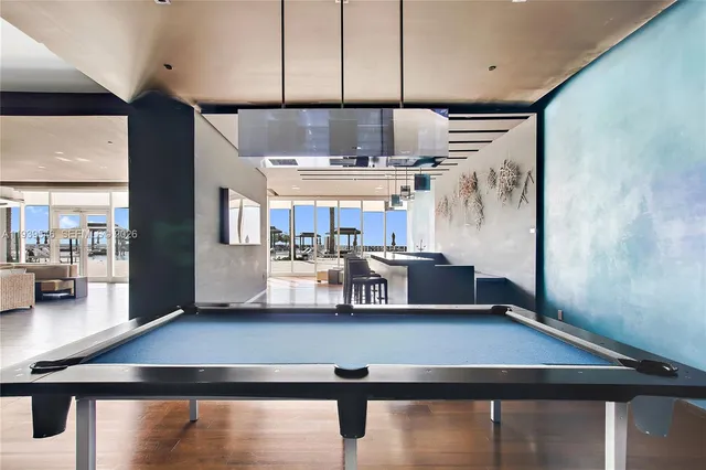 a living room with stainless steel appliances kitchen island granite countertop furniture and a kitchen view