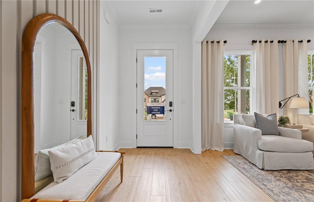 299 Rockledge Bend Powder Springs, GA 30127 - Photo 4 of 12 a living room with furniture and wooden floor