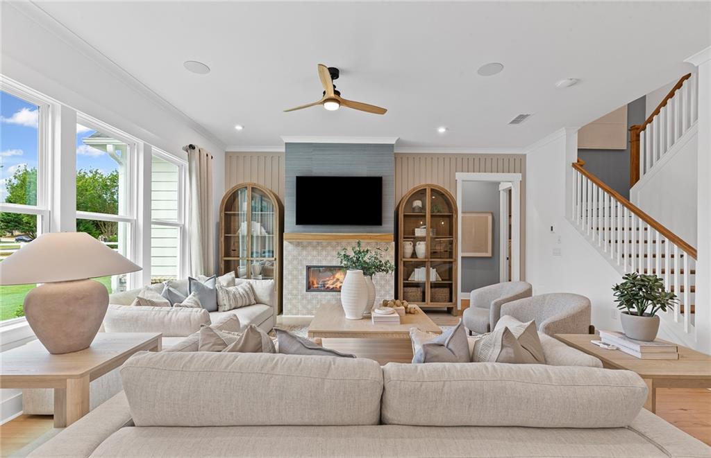 299 Rockledge Bend Powder Springs, GA 30127 - Photo 5 of 12 a living room with fireplace furniture and a large window