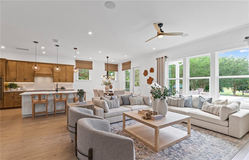 299 Rockledge Bend Powder Springs, GA 30127 - Photo 6 of 12 a living room with furniture kitchen view and a large window