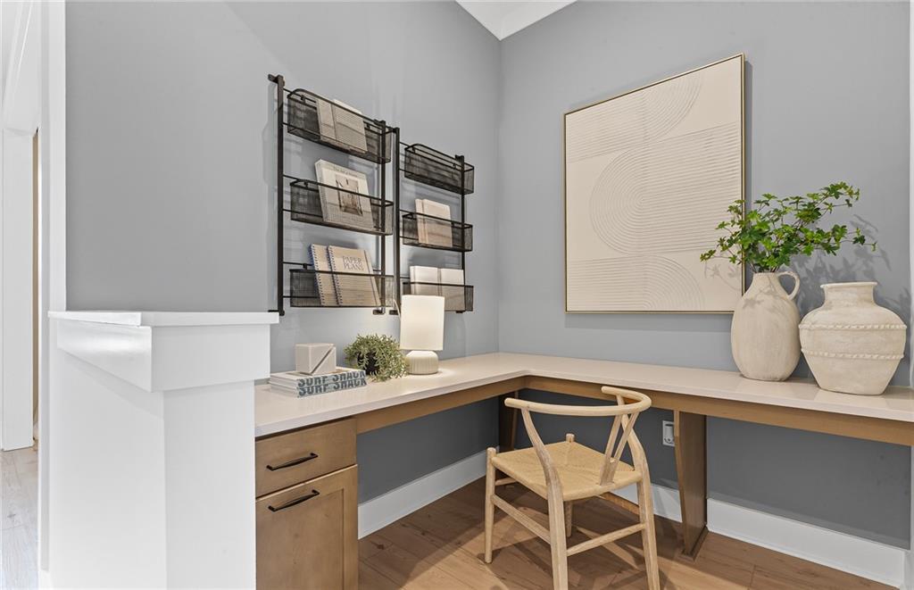299 Rockledge Bend Powder Springs, GA 30127 - Photo 8 of 12 a dining room with table chairs and wooden floor