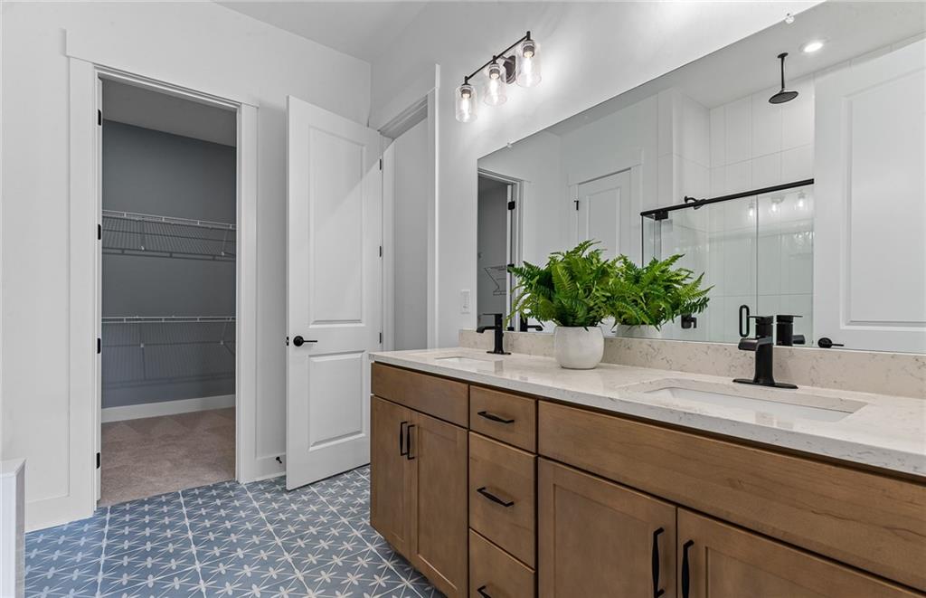 299 Rockledge Bend Powder Springs, GA 30127 - Photo 10 of 12 a bathroom with a sink and a mirror