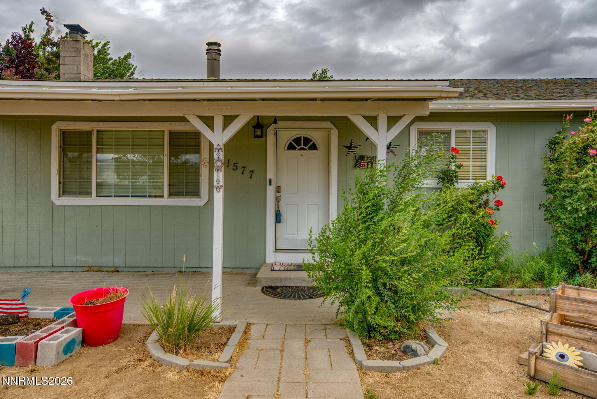 11577 Deodar Way Reno, NV 89506 - Photo 41 of 58 a view of a house with potted plants