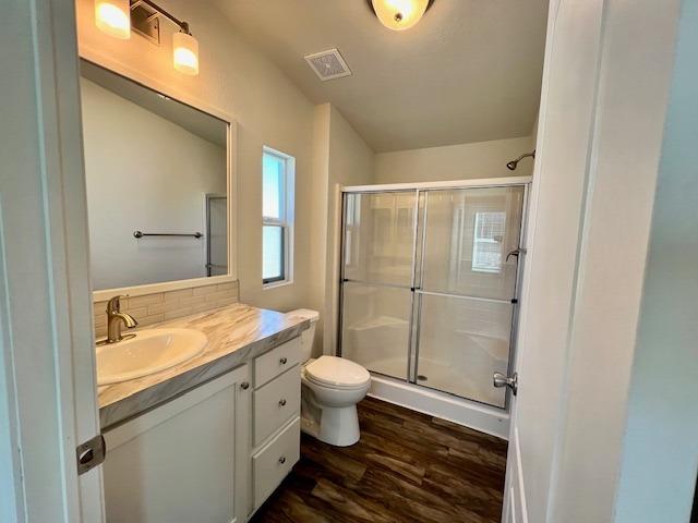 1650 Villa Avenue, Unit 5 Clovis, CA 93612 - Photo 18 of 31 a bathroom with a granite countertop sink a toilet a mirror and shower