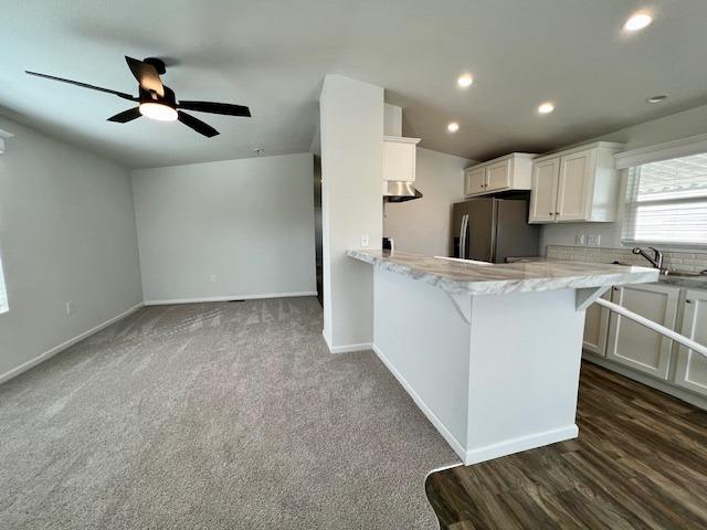 1650 Villa Avenue, Unit 5 Clovis, CA 93612 - Photo 23 of 31 a view of a kitchen with a sink and dishwasher a refrigerator with wooden floor