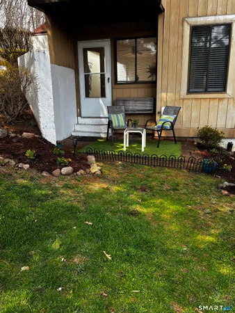 a view of a dinning room with furniture and a yard