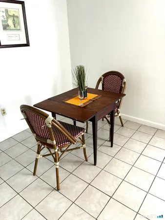 a view of a workspace with furniture