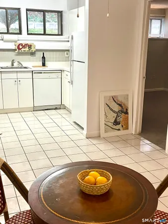 a view of a kitchen with a sink and a stove