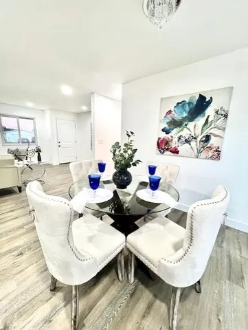 a living room with furniture and flowers