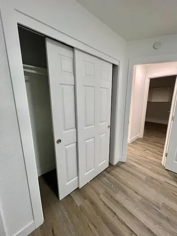 a view of entryway with wooden floor