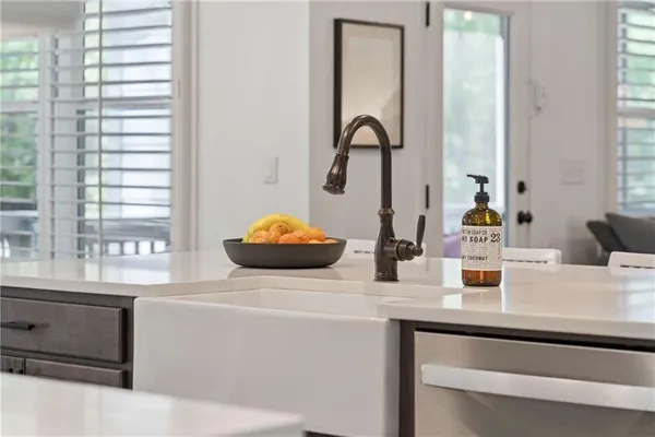 a kitchen with a refrigerator and a stove