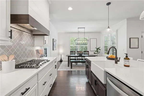 a kitchen with cabinets and a stove